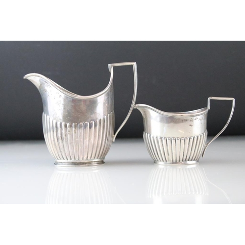 816 - Silver three piece tea service comprising teapot, twin handled sugar bowl and milk jug, gadrooning t... 