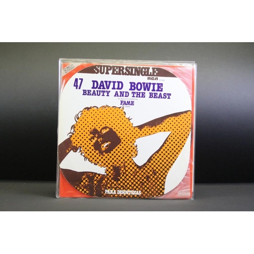 277 - Vinyl - 11 David Bowie foreign pressing 12” singles including Demos Promos, to include: Never Let Me... 