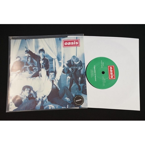 402 - Vinyl - two original 12” singles and 2 original 7” singles by Oasis to include: Whatever (UK 1st Dam... 