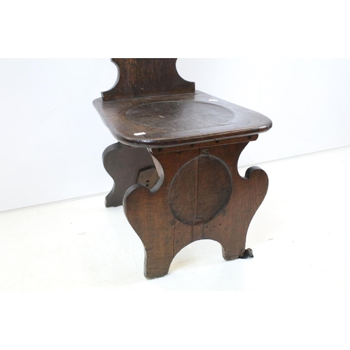 697 - 19th century Oak Hall Chair with shaped plain back and solid seat and two shaped panel supports, 91c... 