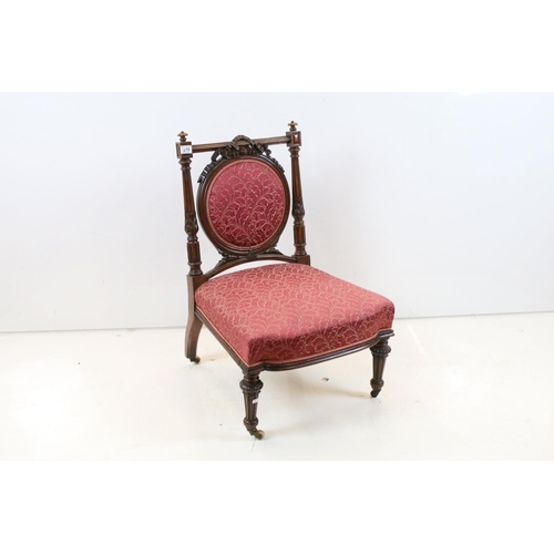 698 - Edwardian Mahogany Nursing Chair, the oval upholstered splat with ribbon carving, upholstered stuff-... 