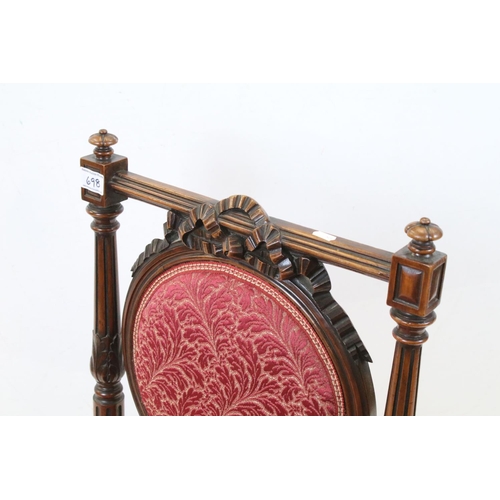 698 - Edwardian Mahogany Nursing Chair, the oval upholstered splat with ribbon carving, upholstered stuff-... 