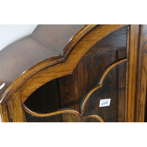 688 - Art Deco Oak Display Cabinet with cloud shaped top, twin glazed doors (a/f) opening to three adjusta... 