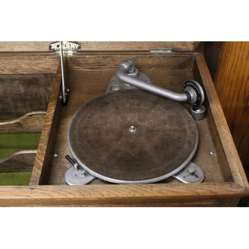 689 - Early 20th century Oak ' Academy ' Gramophone Cabinet, the hinged lid opening to a turntable and div... 