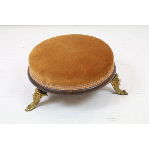 692 - 19th century Circular Footstool, gold coloured upholstered top raised on a wooden frame with three g... 