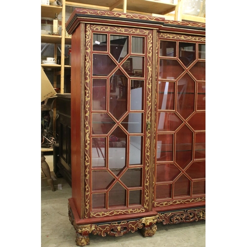 693 - Red Lacquered and Gilt decorated Inverted Breakfront Display Cabinet in the Chinese manner, the cent... 