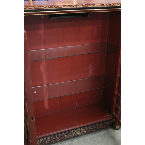 693 - Red Lacquered and Gilt decorated Inverted Breakfront Display Cabinet in the Chinese manner, the cent... 