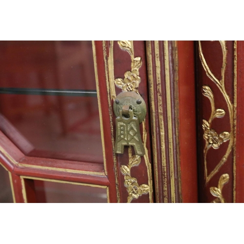 693 - Red Lacquered and Gilt decorated Inverted Breakfront Display Cabinet in the Chinese manner, the cent... 