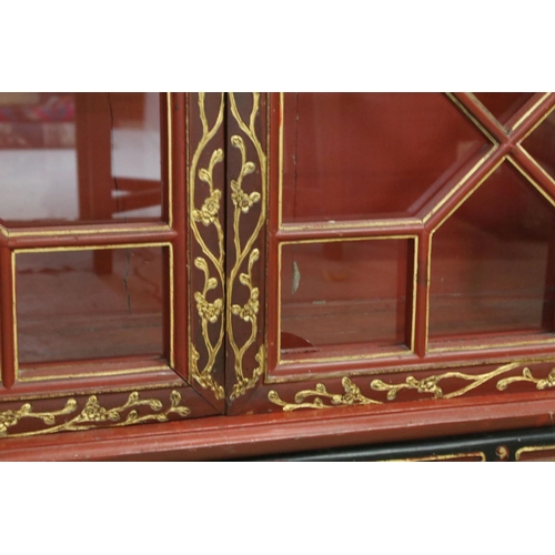 693 - Red Lacquered and Gilt decorated Inverted Breakfront Display Cabinet in the Chinese manner, the cent... 