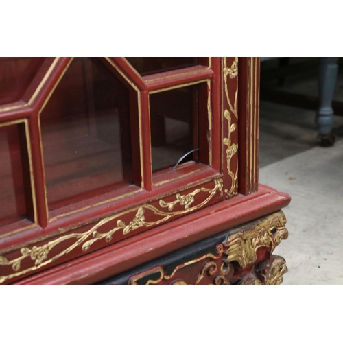 693 - Red Lacquered and Gilt decorated Inverted Breakfront Display Cabinet in the Chinese manner, the cent... 