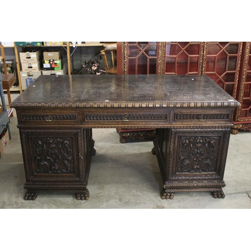 705 - 19th century Dark Oak Twin Pedestal Desk with three carved front drawers, each pedestal with heavily... 