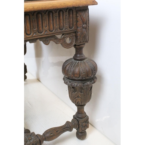 706 - Jacobean Revival Oak Dining Table  with carved frieze and heavily carved cup and cover supports, 79c... 