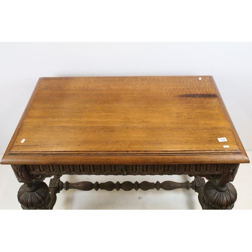 706 - Jacobean Revival Oak Dining Table  with carved frieze and heavily carved cup and cover supports, 79c... 