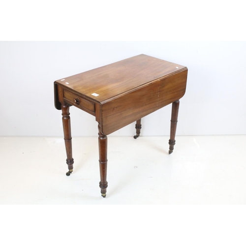 707 - 19th century Mahogany Pembroke Table with drawer to end and raised on turned legs terminating in cas... 