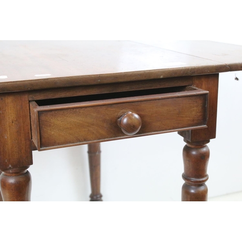 707 - 19th century Mahogany Pembroke Table with drawer to end and raised on turned legs terminating in cas... 