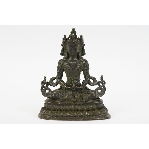 218 - Buddhist bronze figure of Guan Yin in a seated pose