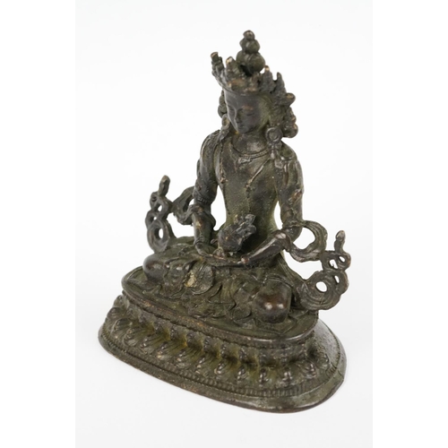 218 - Buddhist bronze figure of Guan Yin in a seated pose