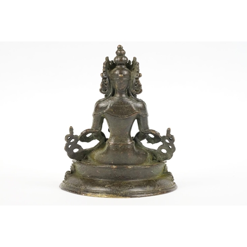 218 - Buddhist bronze figure of Guan Yin in a seated pose