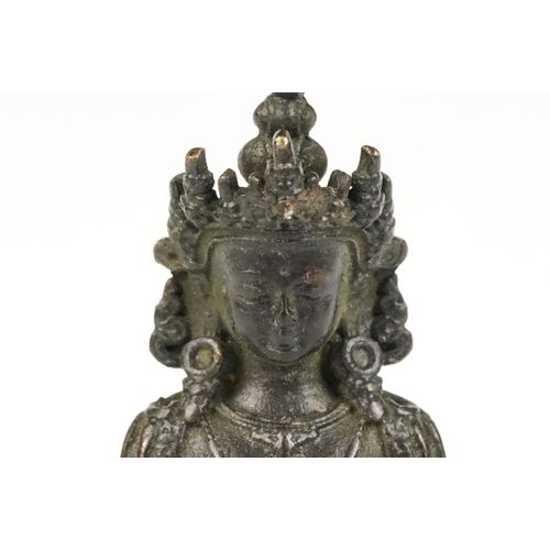 218 - Buddhist bronze figure of Guan Yin in a seated pose