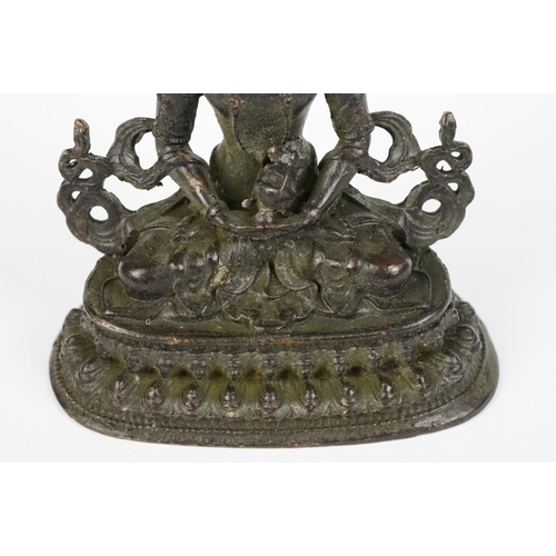 218 - Buddhist bronze figure of Guan Yin in a seated pose