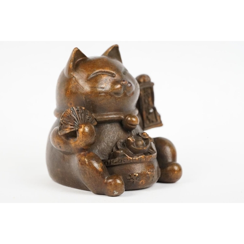 220 - An ornamental Japanese bronze 招き猫 / maneki-neko (waving / beckoning) lucky cat talisman.