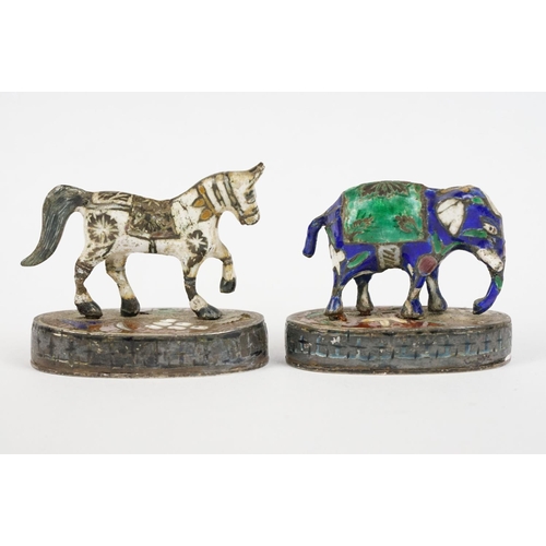 221 - A sterling silver miniature horse and elephant figures with enamel decoration.