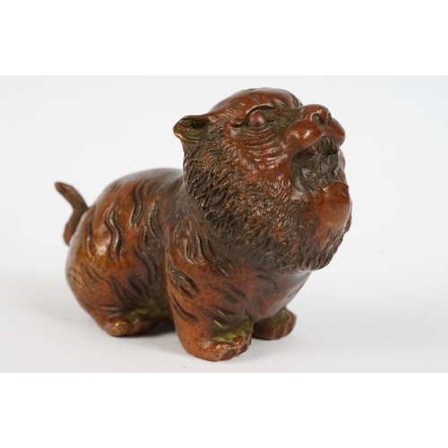 224 - An ornamental Chinese bronze tiger, stands approx 4cm in height.