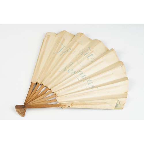 225 - An antique French paper fan with figural decoration on wooden frame, marked the Ritz Restaurant to v... 