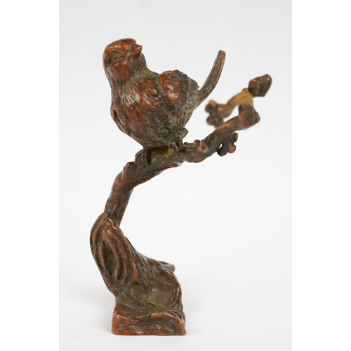 228 - A Chinese bronze ornamental bird on cherry blossom branch.