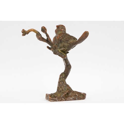 228 - A Chinese bronze ornamental bird on cherry blossom branch.