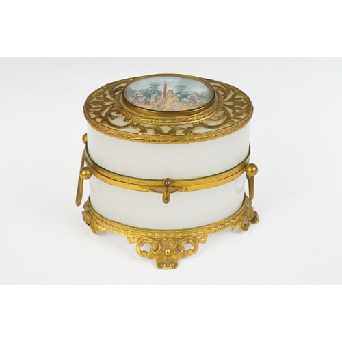 229 - An antique opaque glass and gilt metal with central panel jewellery / trinket box / casket.