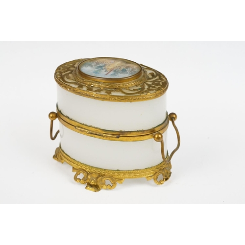 229 - An antique opaque glass and gilt metal with central panel jewellery / trinket box / casket.