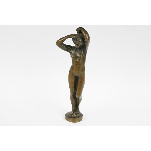 230 - A bronze figure of a nude lady, stands approx 16cm in height.