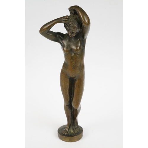 230 - A bronze figure of a nude lady, stands approx 16cm in height.