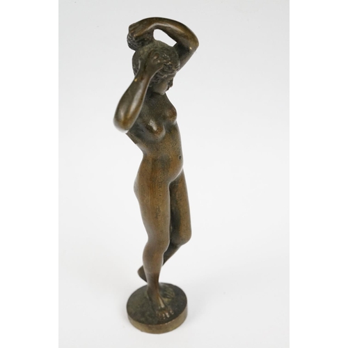 230 - A bronze figure of a nude lady, stands approx 16cm in height.