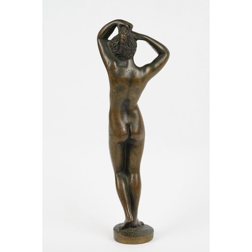 230 - A bronze figure of a nude lady, stands approx 16cm in height.