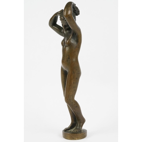 230 - A bronze figure of a nude lady, stands approx 16cm in height.