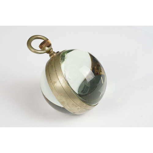 231 - A vintage glass globe table top pocket watch.