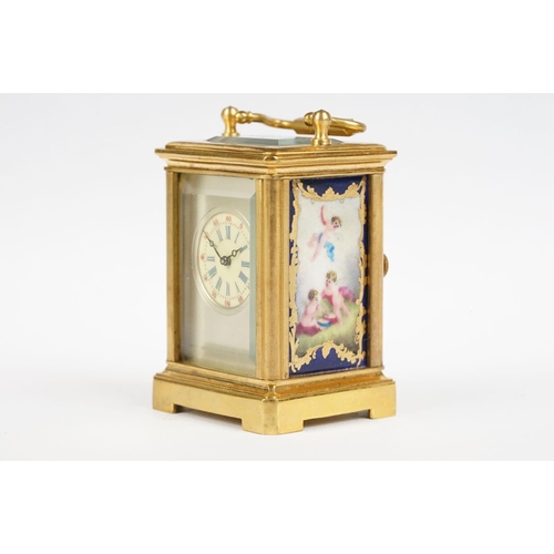 232 - A miniature antique brass cased carriage clock with enamel panels with cherub decoration.