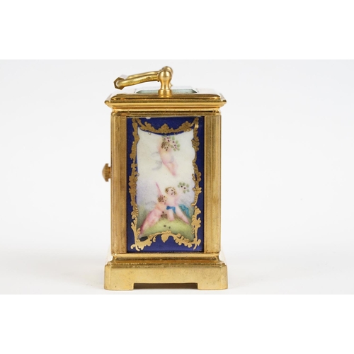 232 - A miniature antique brass cased carriage clock with enamel panels with cherub decoration.