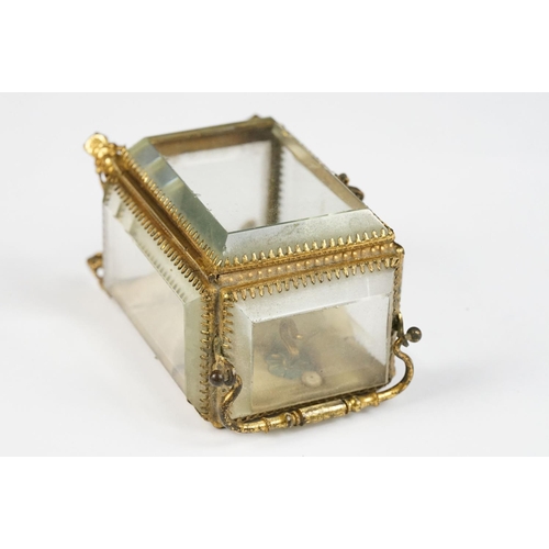 234 - An antique 19th century glass paneled jewellery casket.