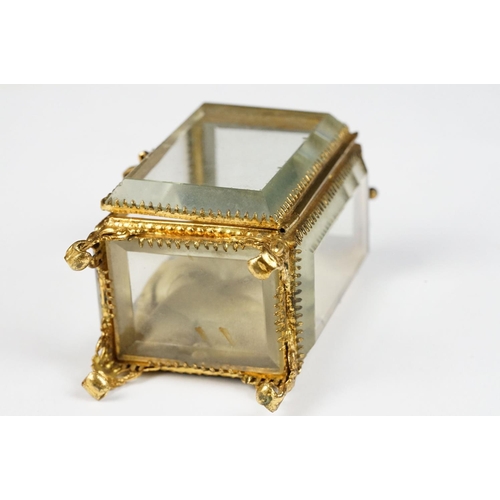 234 - An antique 19th century glass paneled jewellery casket.