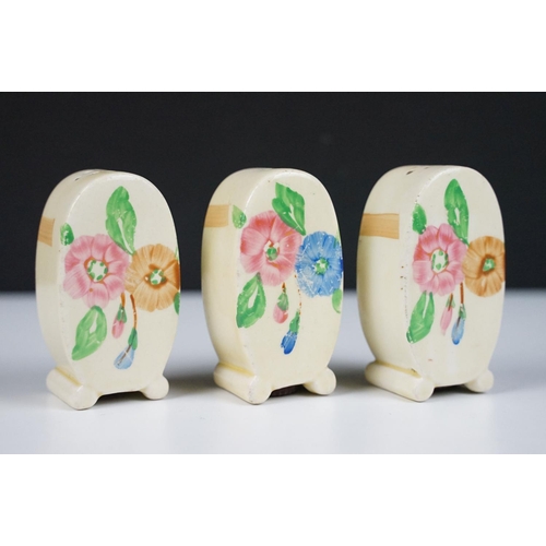 28 - Clarice Cliff for Newport Pottery five piece cruet set of 'Bonjour' form, with hand painted floral d... 