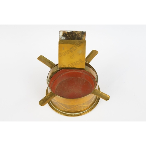 289 - A trench art ashtray matchbox holder combination made from a brass artillery round together with an ... 