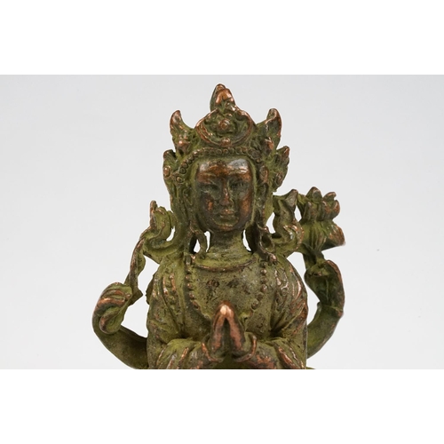 290 - An oriental bronze figure of Guanyin, stands approx 10cm in height.