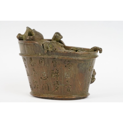 293 - A Chinese cast metal incense burner in the form of Chan Chuy in the bath.