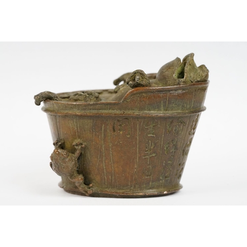 293 - A Chinese cast metal incense burner in the form of Chan Chuy in the bath.