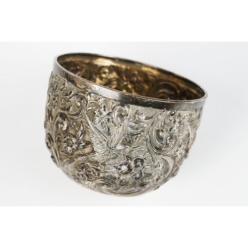 298 - A fully hallmarked sterling silver bowl with floral and bird repouse design.