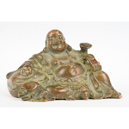 308 - An oriental copper buddha figure, stands approx 6cm in height.