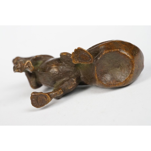 315 - An ornamental chinese bronze lucky fortune rat with bag.